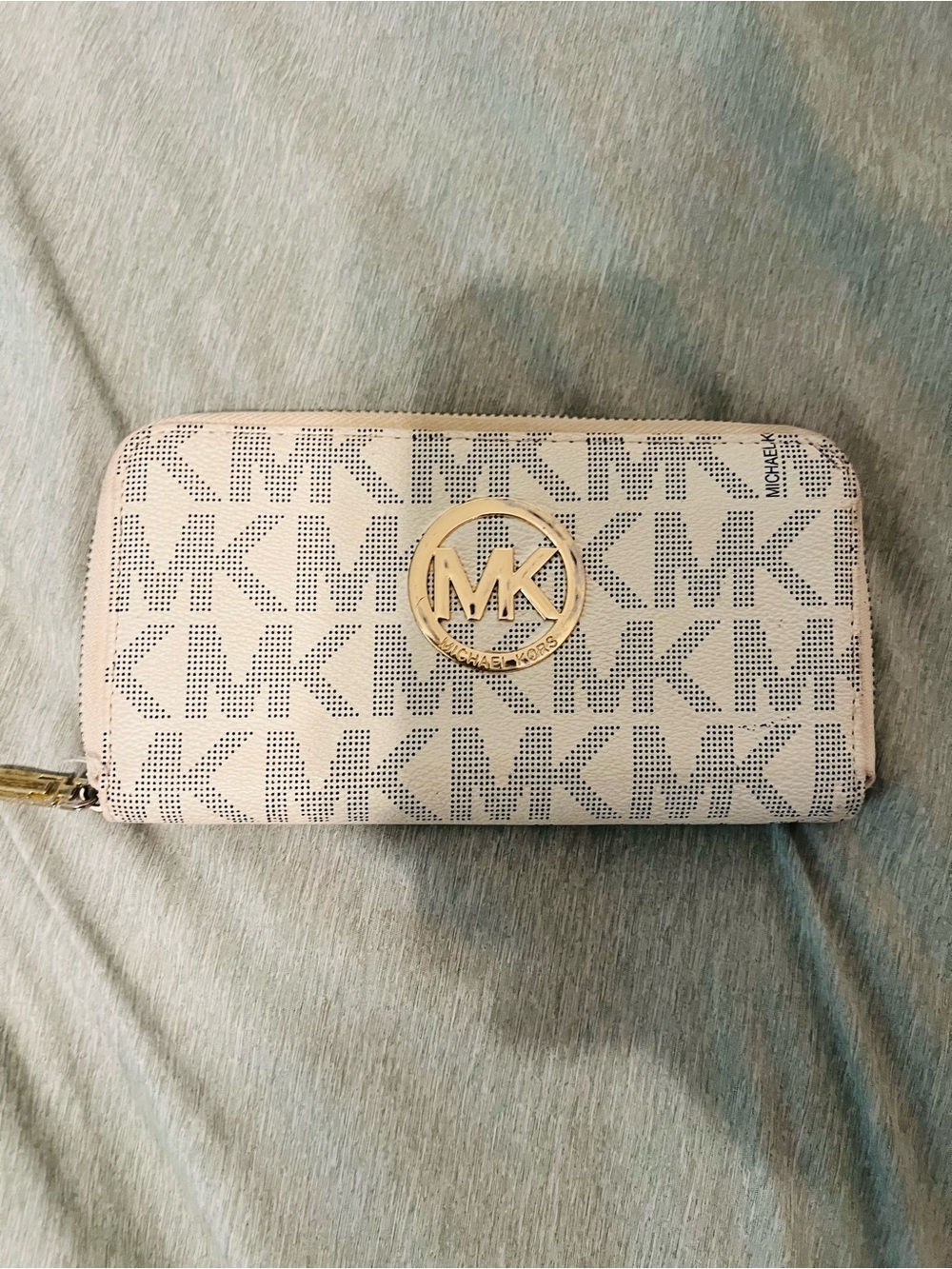 Michael Kors Light Pink Perforated MK Zip Around Wallet with Gold Logo